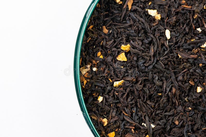 Black Tea with Orange Peel and Cinnamon Closeup Top View Stock Photo