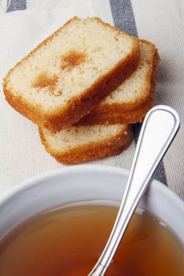 Black Tea with Sugar and Cake with Jam on a Napkin Stock Photo Image