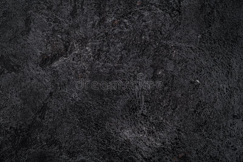 Black texture of volcanic stone surface