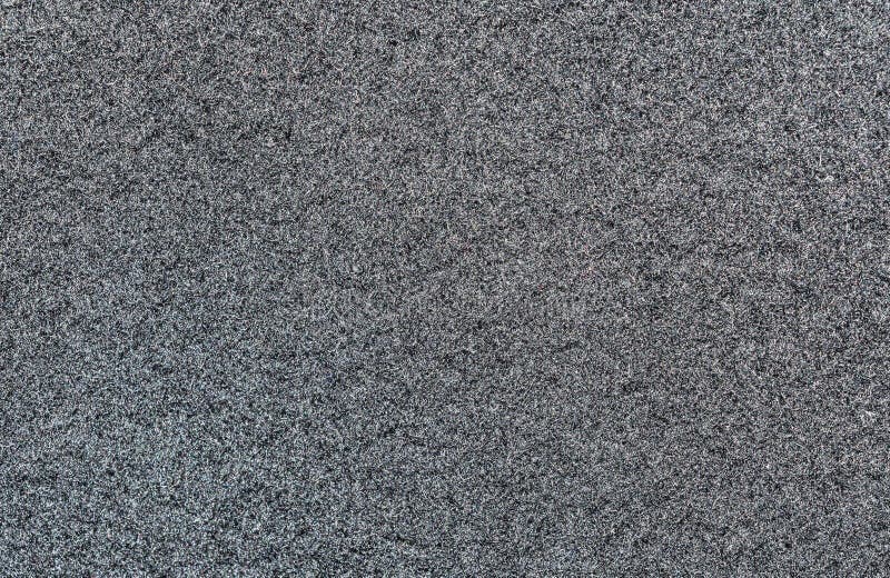 Black texture of woolen fabric for a coat of drape type, abstract background royalty free stock photo