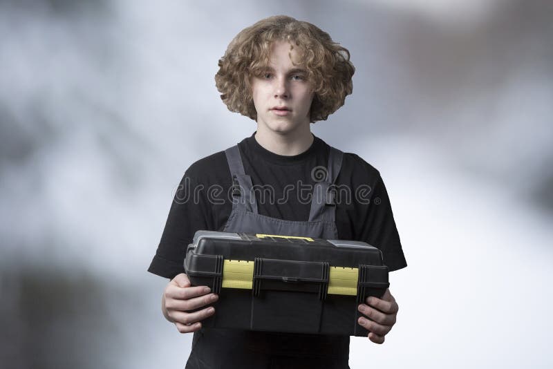 black-tool-box-in-the-hands-of-an-employee-isolate-stock-photo