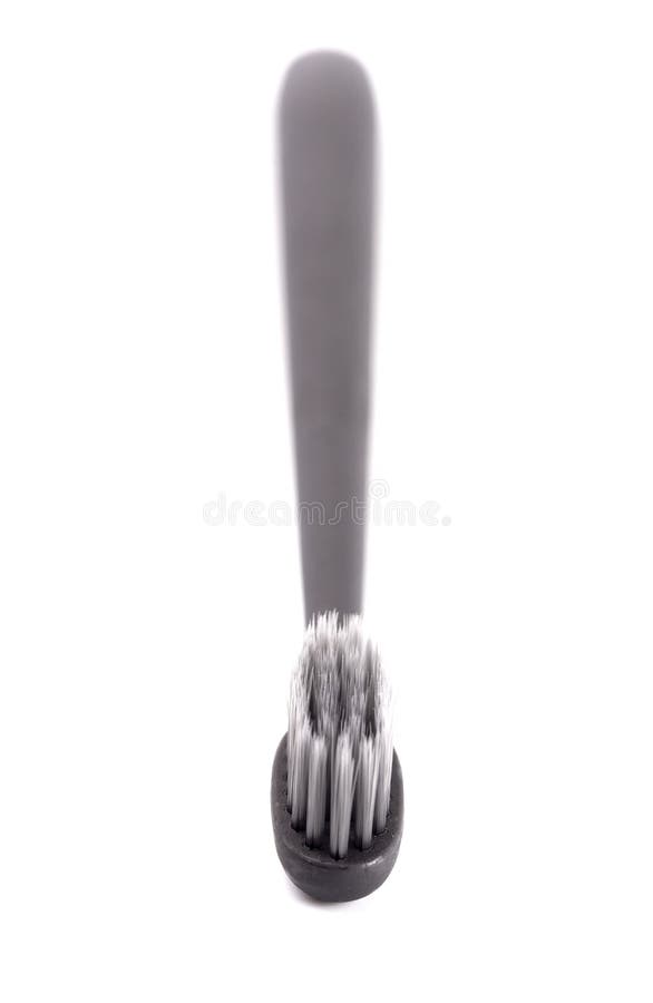 Black Toothbrush without Toothpaste on a White Background Stock Photo