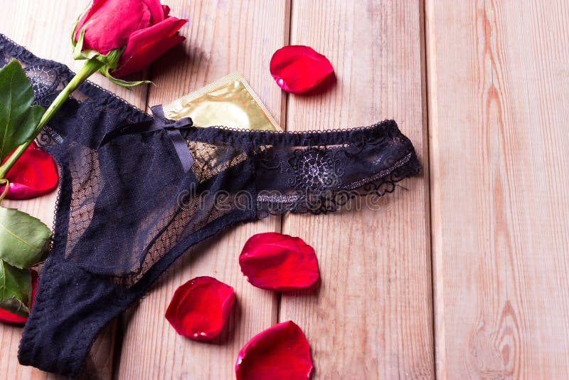 Black underwear and roses stock photo. Image of beauty 100445634