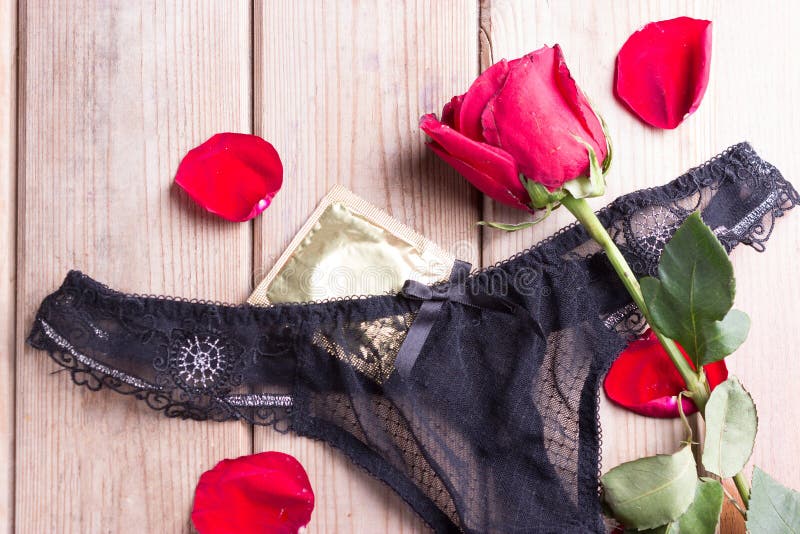 Black underwear and roses stock photo. Image of bride 100445610