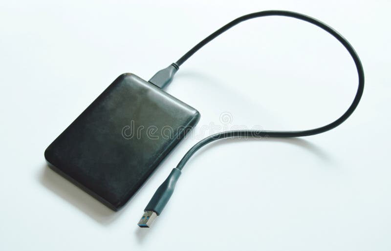 Black universal serial bus external hard disk connecting to computer on white background royalty free stock photos