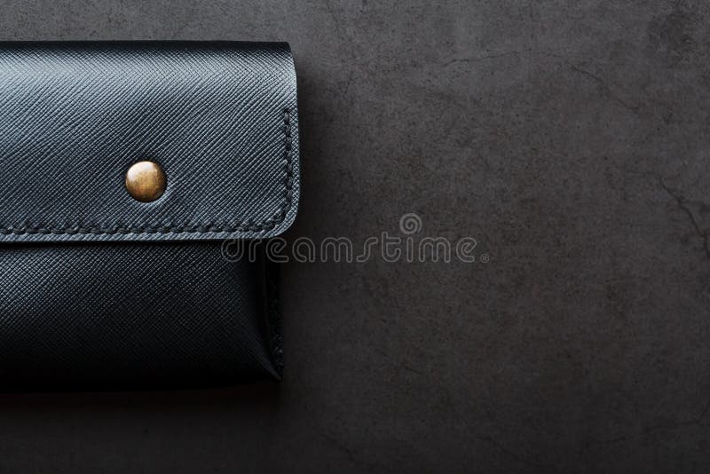 Black Wallet Made of Genuine Leather on a Dark Background. Handmade ...