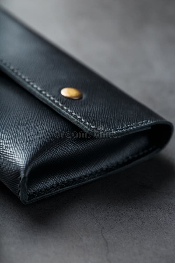 Black Wallet Made of Genuine Leather on a Dark Background. Handmade ...