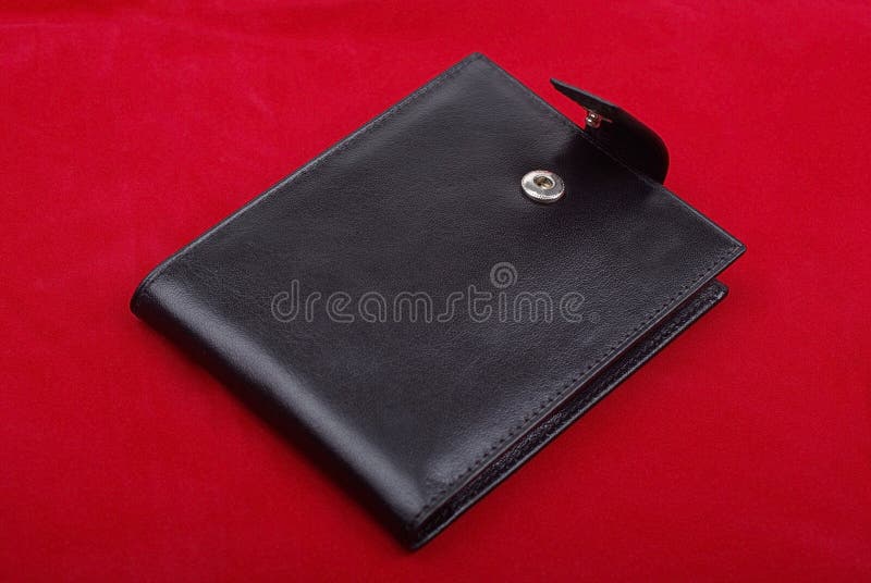 Black leather wallet on red background money purse finance shopping currency object business wealth cash single pay rich personal.