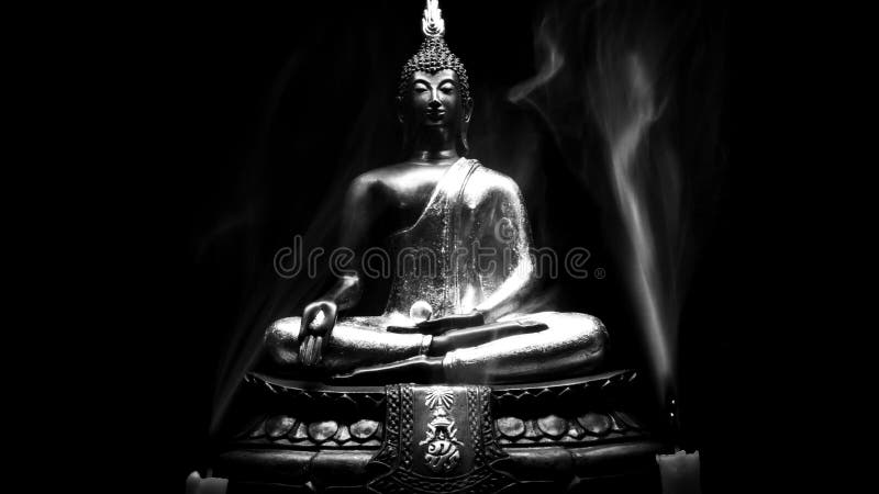 Black and whihte style of Buddha statue and Candle smoke with light dark background.