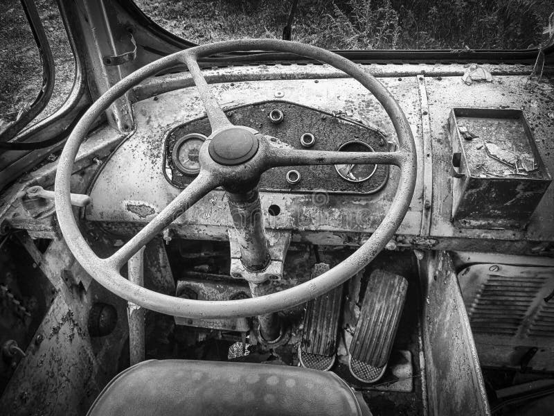 Black and white abandoned trolley car steering wheel