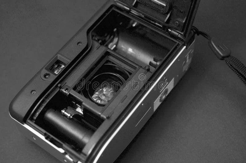 Black and white camera film 35mm on table background stock image Black and white camera film 35mm on table background stock image