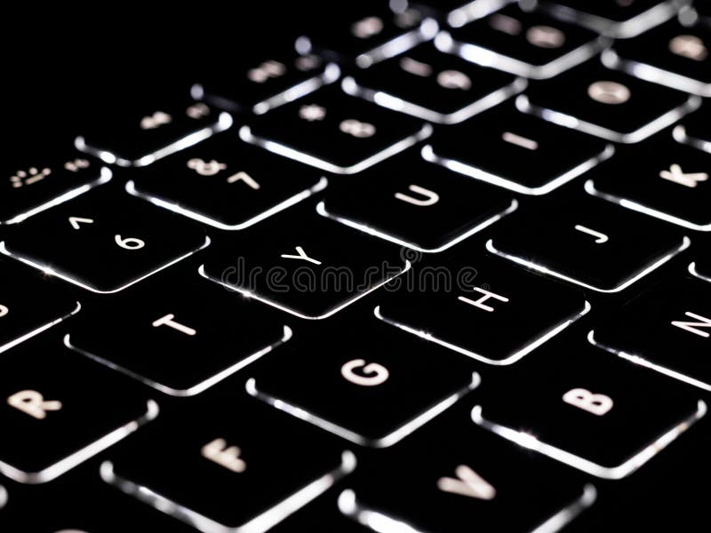 Black and white close-up on illuminated keys of computer keyboard stock photo Black and white close-up on illuminated keys of computer keyboard stock photo