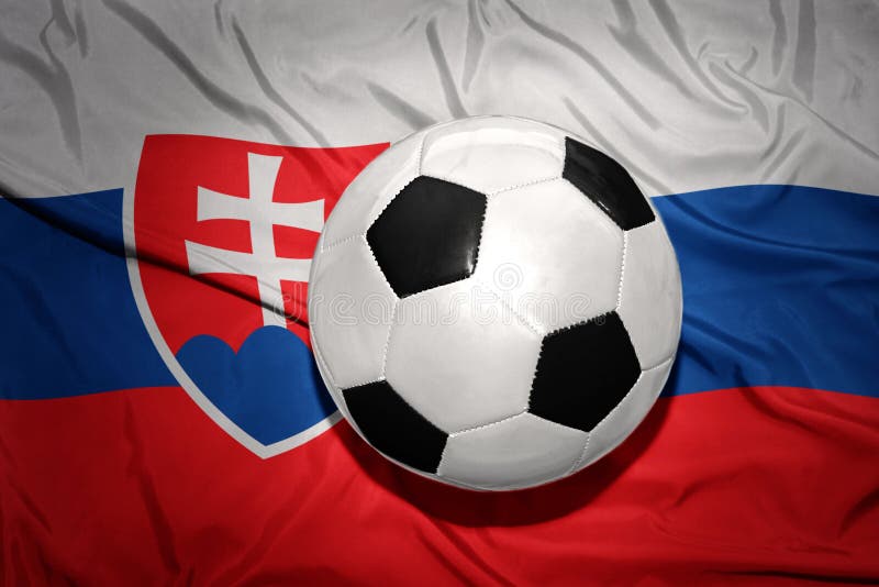 Black and white football ball on the national flag of slovakia