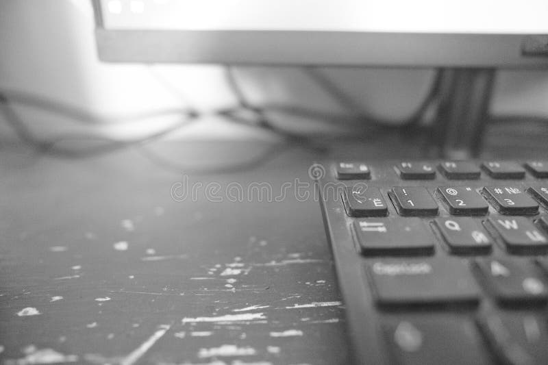 Black and White Image of a Computer Keyboard on the Table Stock Image