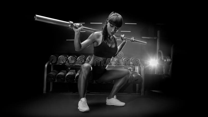 Black and white image of fit young woman in great shape lifting stock photos Black and white image of fit young woman in great shape lifting stock photos