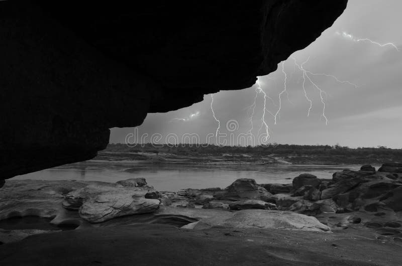Black and white image of scary thunderstorm far away stock photos
