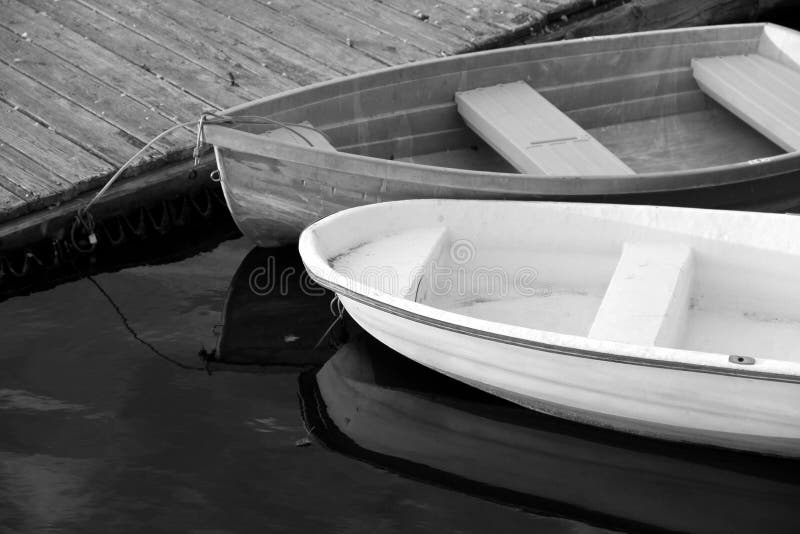 Black and white image of two rowboats