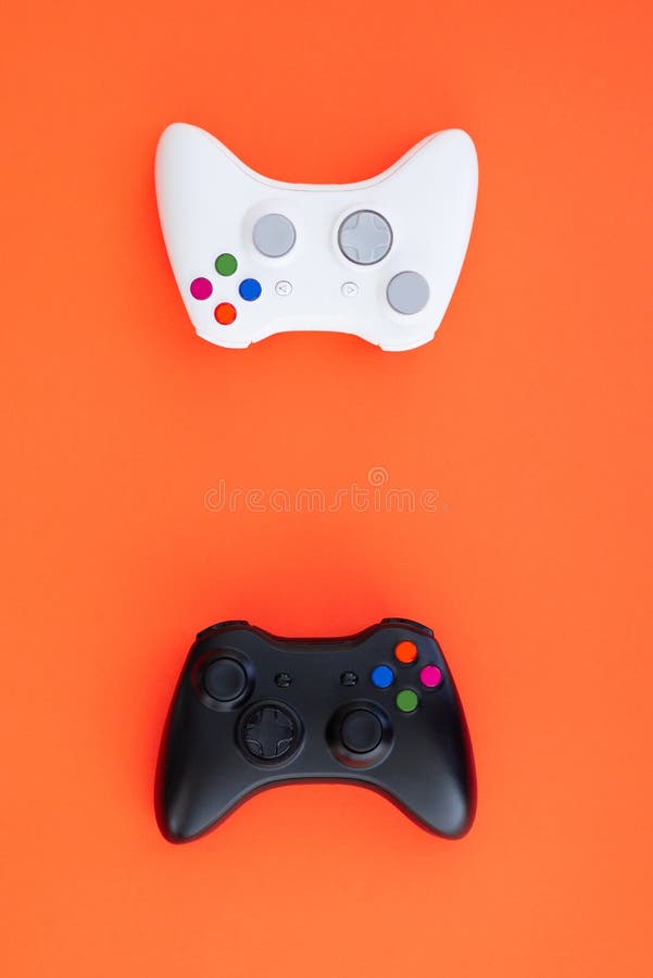 Black and white joystick on a red background. White and black gamepad is isolated on a red background royalty free stock images Black and white joystick on a red background. White and black gamepad is isolated on a red background royalty free stock images