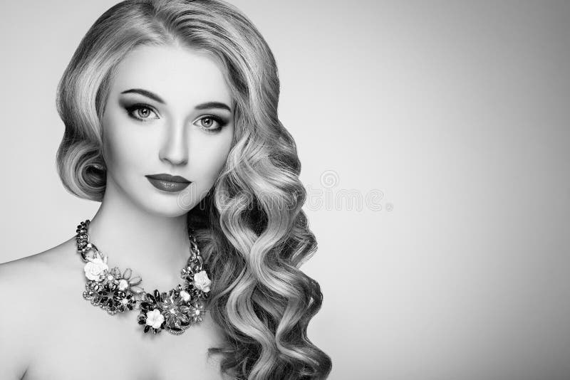 Black and white photo of beautiful woman with elegant hairstyle