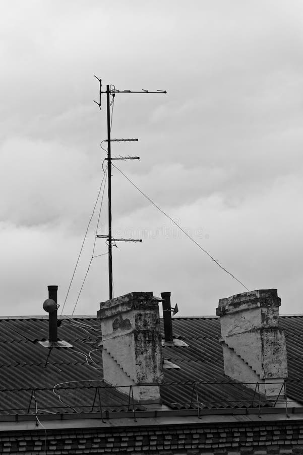 Black and white photo of chimneys and television aerial on the roof of a building. Komsomolsk-on-Amure, Russia royalty free stock photo Black and white photo of chimneys and television aerial on the roof of a building. Komsomolsk-on-Amure, Russia royalty free stock photo