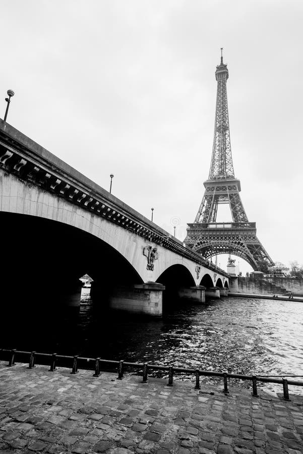 Black and white photo of Eiffel tower and Jena bridge