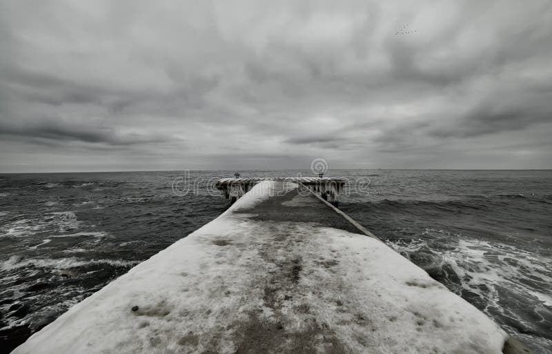 Black and white photo of winter pier