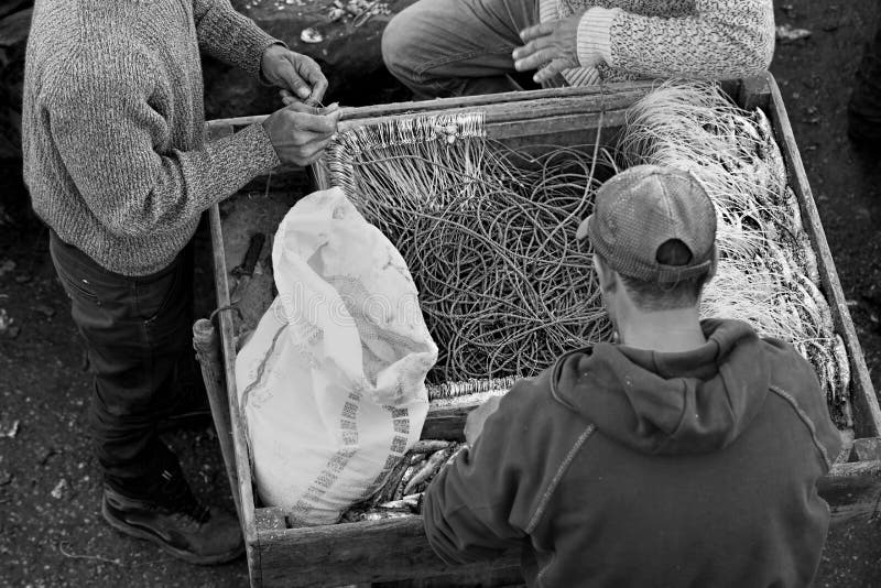 Black and white photograph fishermen at work