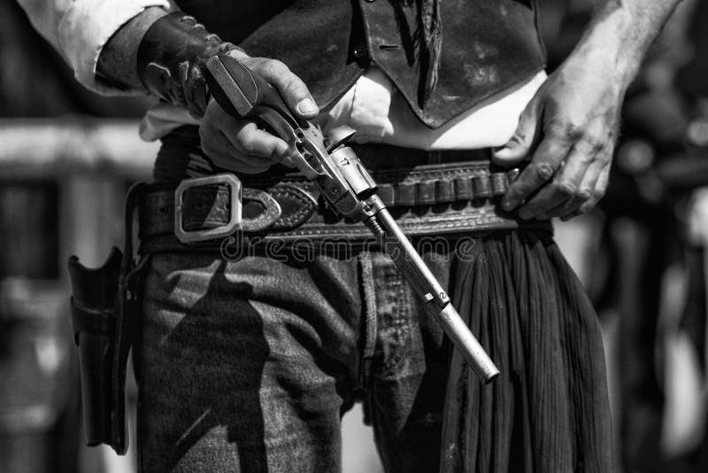 Black and White Photograph of Gunfighter and colt revolver