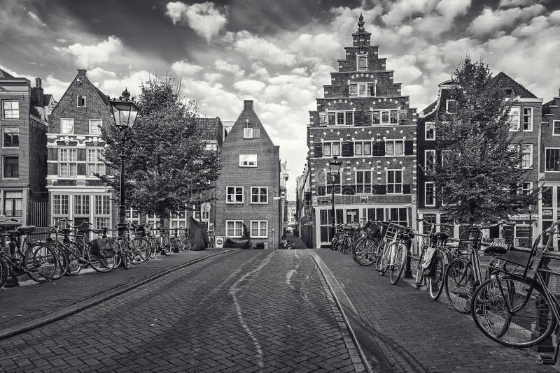 Black and white picture of bicycles parked on a bridge across th stock image Black and white picture of bicycles parked on a bridge across th stock image