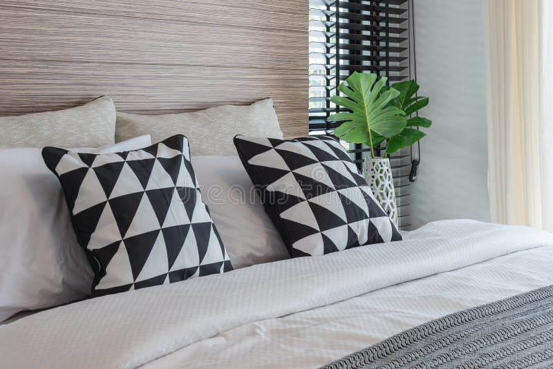 Black and White Pillows on Bed in Modern Bedroom Stock Image - Image of ...