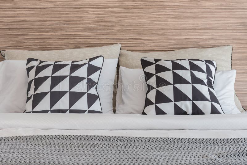 Black and White Pillows on Bed in Modern Bedroom Stock Photo - Image of ...