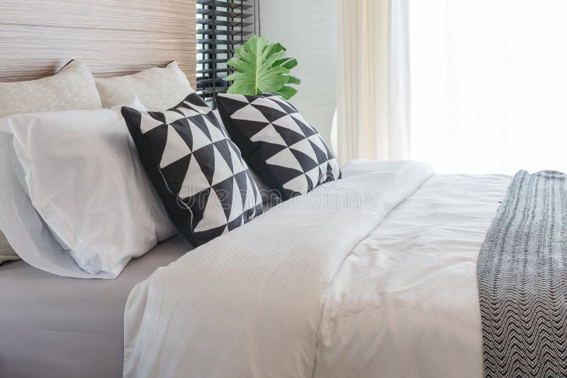 Black and White Pillows on Bed in Modern Bedroom Stock Image - Image of ...