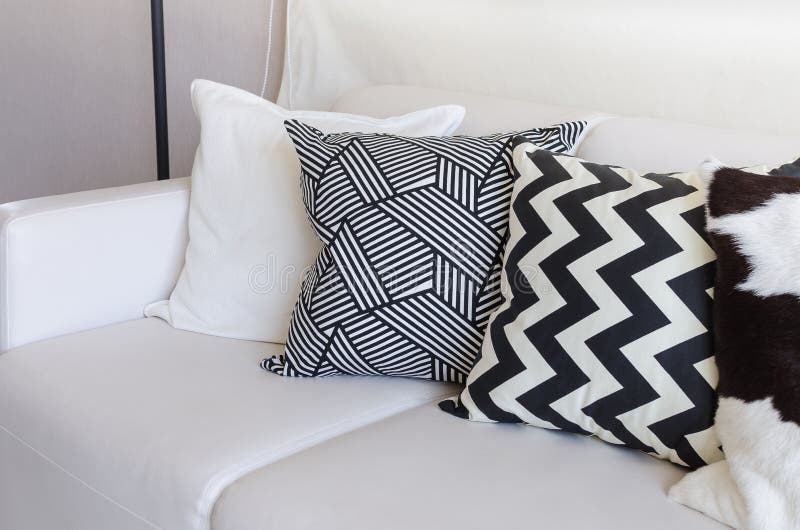 Black and White Pillows on Sofa in Living Room at Home Stock Image