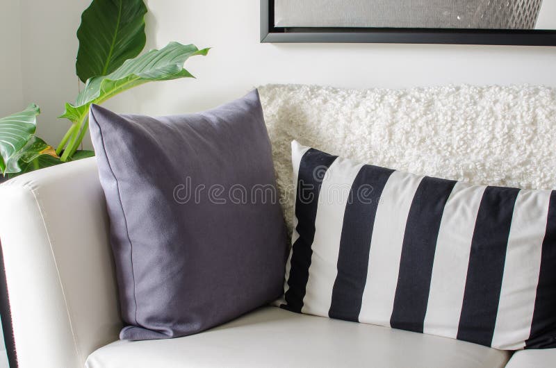 Black and White Pillows on White Sofa in Modern Living Room Stock Image