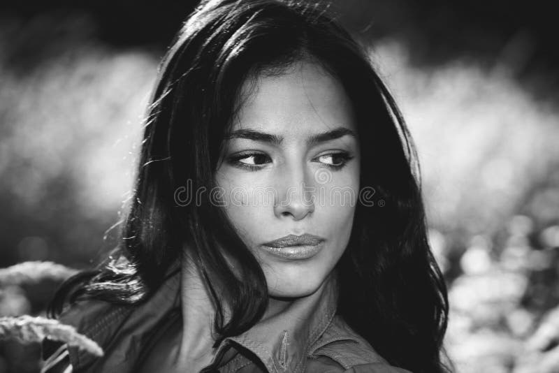 Black and white portrait of a beautiful woman outdoor stock image