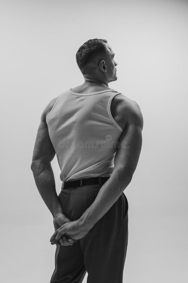 Black and White Portrait of Muscular Man with Wide Back Posing Over Grey  Studio Background. Masculinity and Stock Photo - Image of caucasian, hands:  270778592