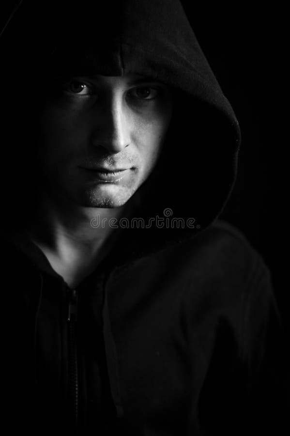 Black and White Portrait of a Young Blue-eyed Man with a Hood Covering ...