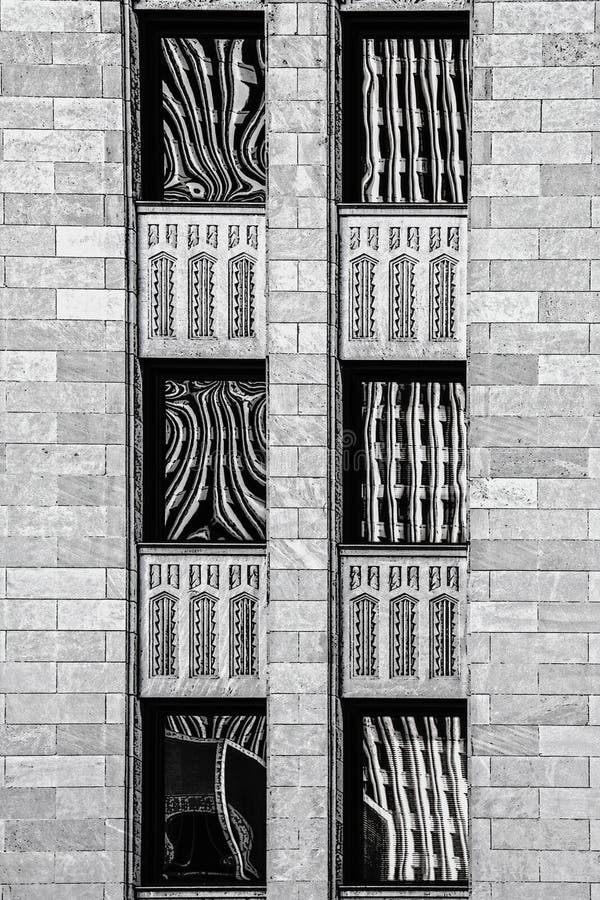 Black and white rendering of art deco building with abstract reflections in six windows - close-up royalty free illustration Black and white rendering of art deco building with abstract reflections in six windows - close-up royalty free illustration