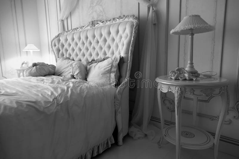 Black and white shot of luxurious bedroom interior at hotel
