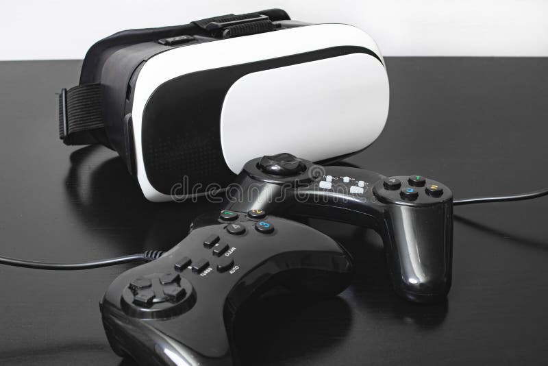Black and white virtual glasses and two playing joystick stock image