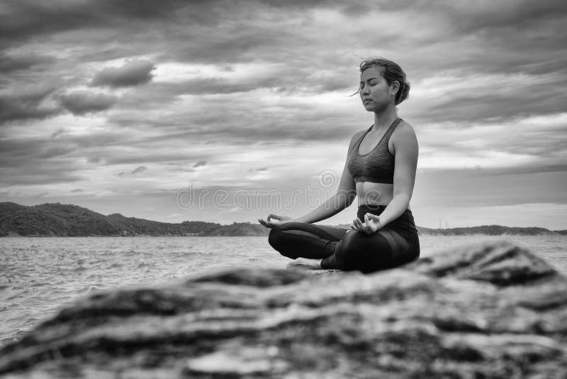 Black and White Yoga on the Rock at the Sunset Stock Photo - Image of ...