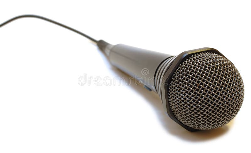 Black wired karaoke microphone with gray metal grill on isolated background. Black wired karaoke microphone with gray metal grill on isolated background.