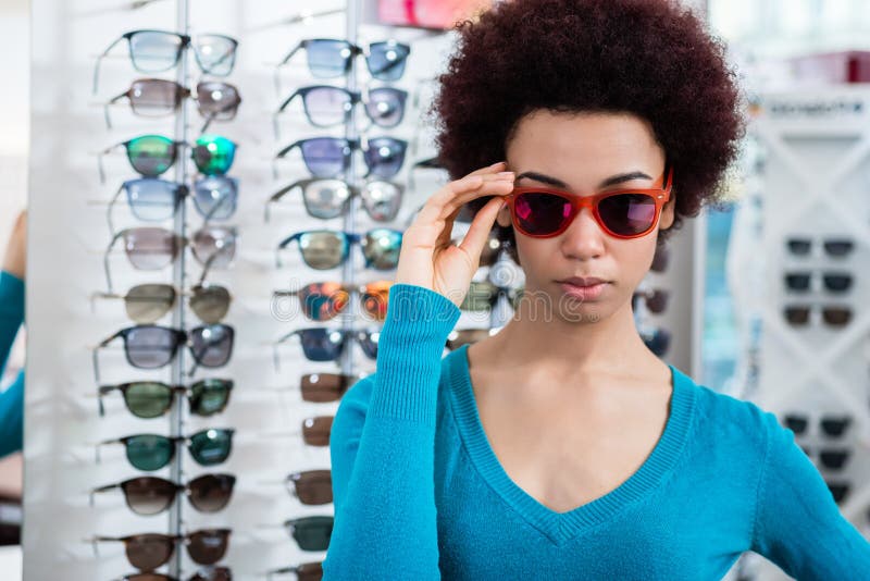 Black Woman Wearing Sunglasses In Optician Shop Stock Image Image Of 