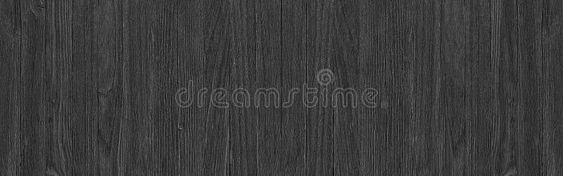 Black wood surface texture as a background, wide panorama. Black wood texture, empty wooden table surface or wall as background