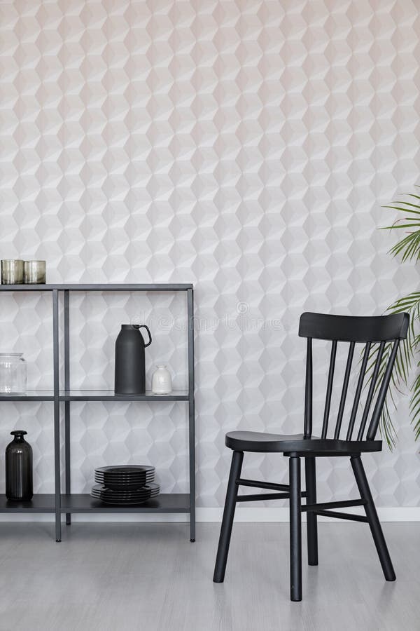 Black wooden chairs next to metal shelf with vases, plate and accessories on empty wall wall with unique wallpaper, real photo vector illustration Black wooden chairs next to metal shelf with vases, plate and accessories on empty wall wall with unique wallpaper, real photo vector illustration