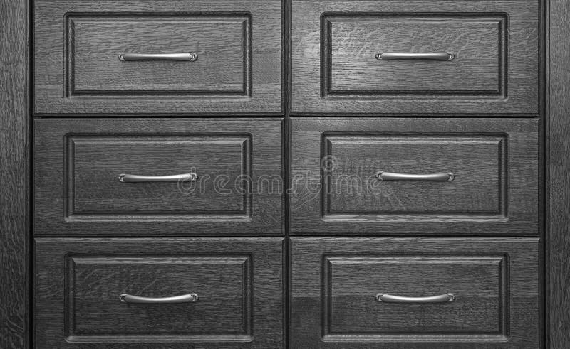 Black Wooden Chest Of With Drawers With Metal Handles Closeup