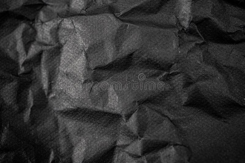 Black wrinkled paper texture for you design background. royalty free stock photography