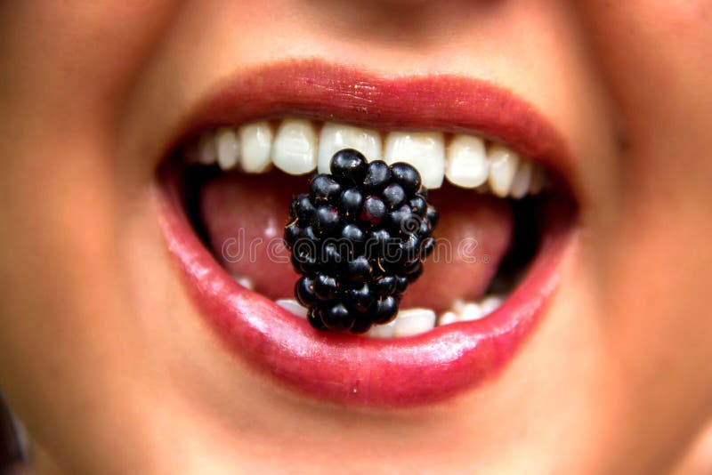Blackberry in Woman Mouth stock image. Image of mouth 48588425