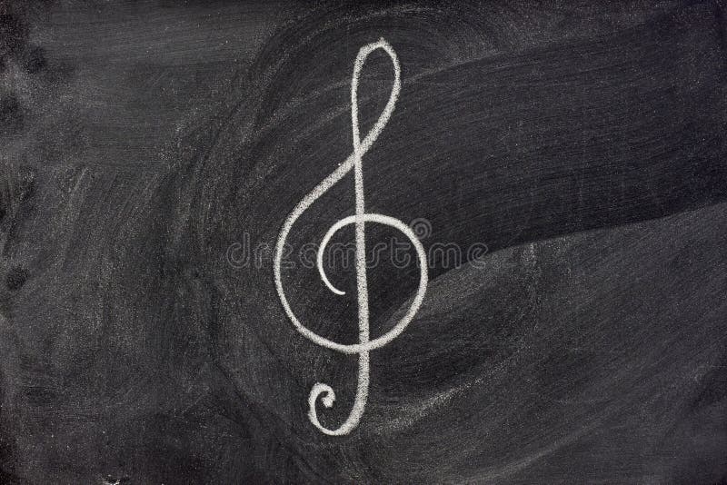 Common musical notation sign, treble clef or music symbol in general, sketched with white chalk on blackboard. Common musical notation sign, treble clef or music symbol in general, sketched with white chalk on blackboard