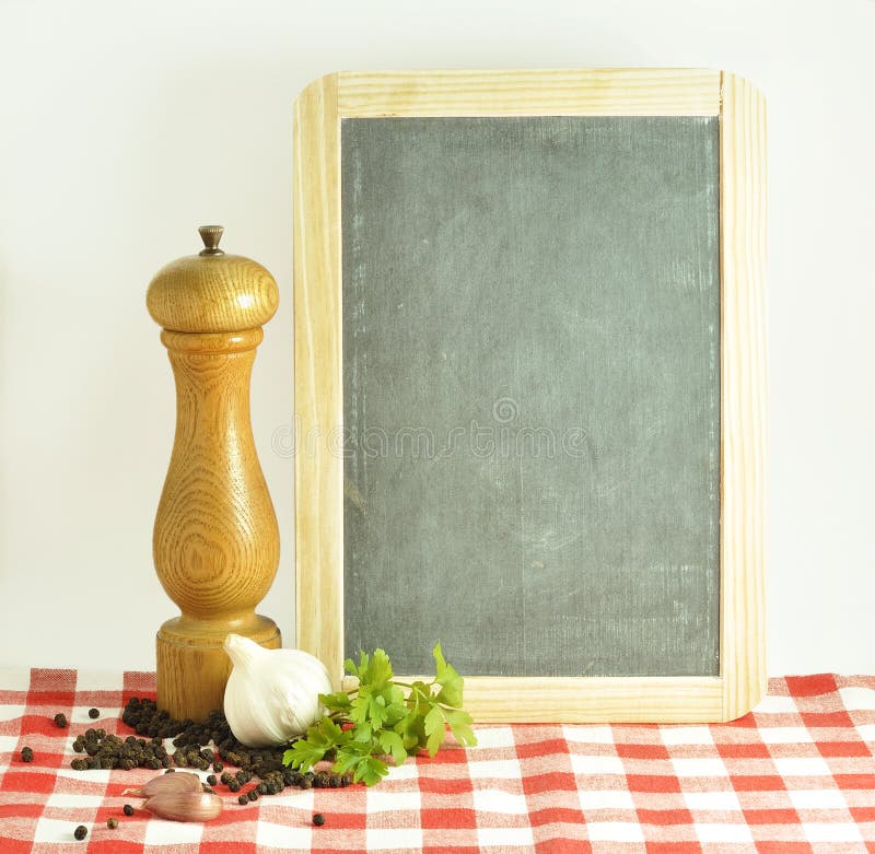 a blackboard with pepper grinder